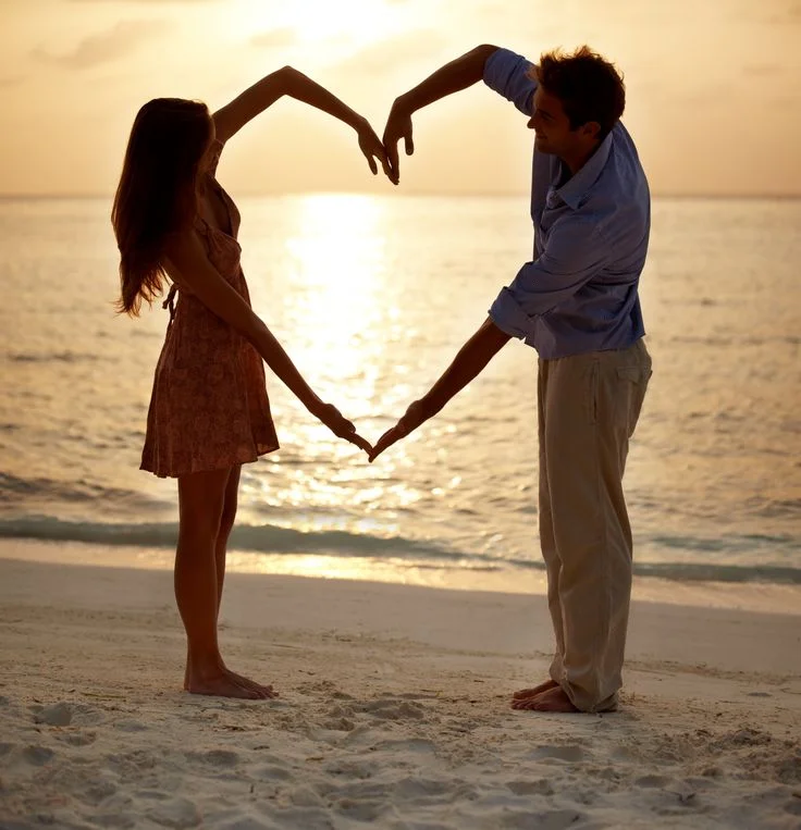 image of couple making heart